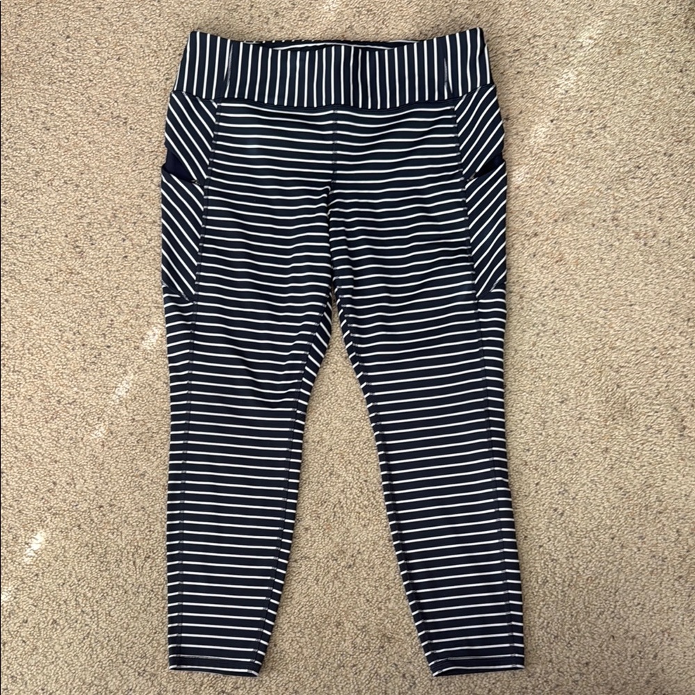 Athleta Black and White Leggings with Striped Pattern and Tapered Fit